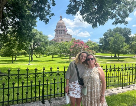 Employee, Sarah, standing next to her mom